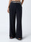 Bombay Paisley Black Solid Flared Pants with Belt