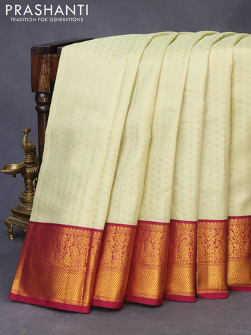 Pure kanchipuram silk saree cream and dark pink with allover zari woven butta weaves and zari woven korvai border