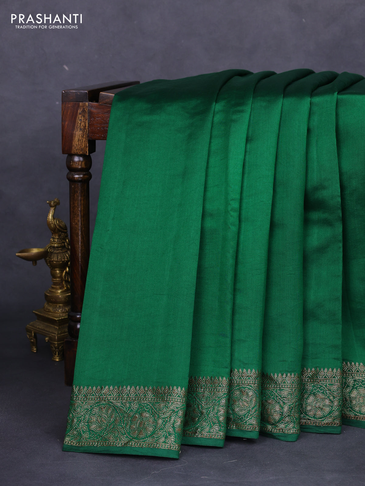 Chiniya silk saree green with plain body and woven border