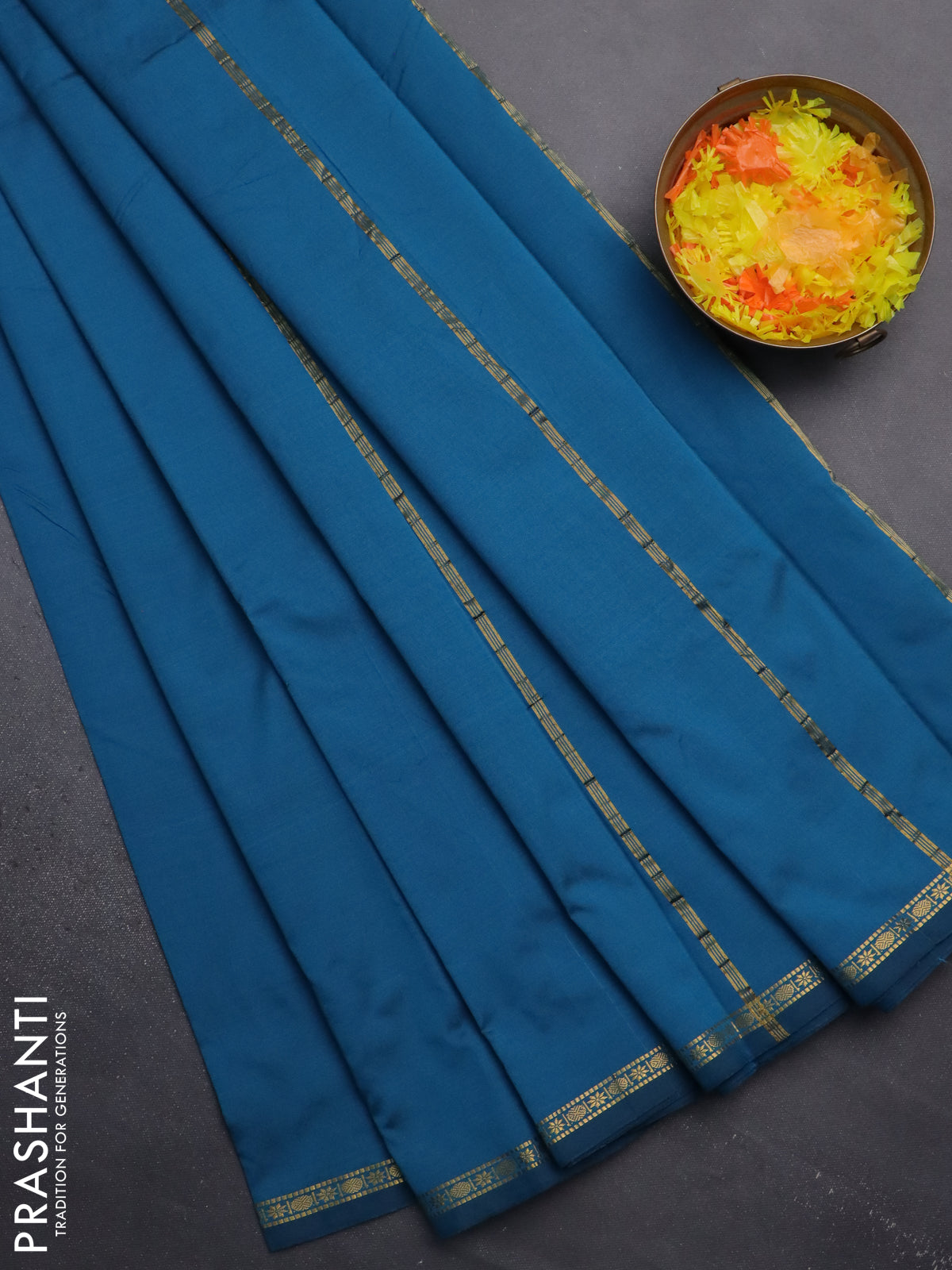 Arani semi silk saree peacock blue with plain body and small zari woven border