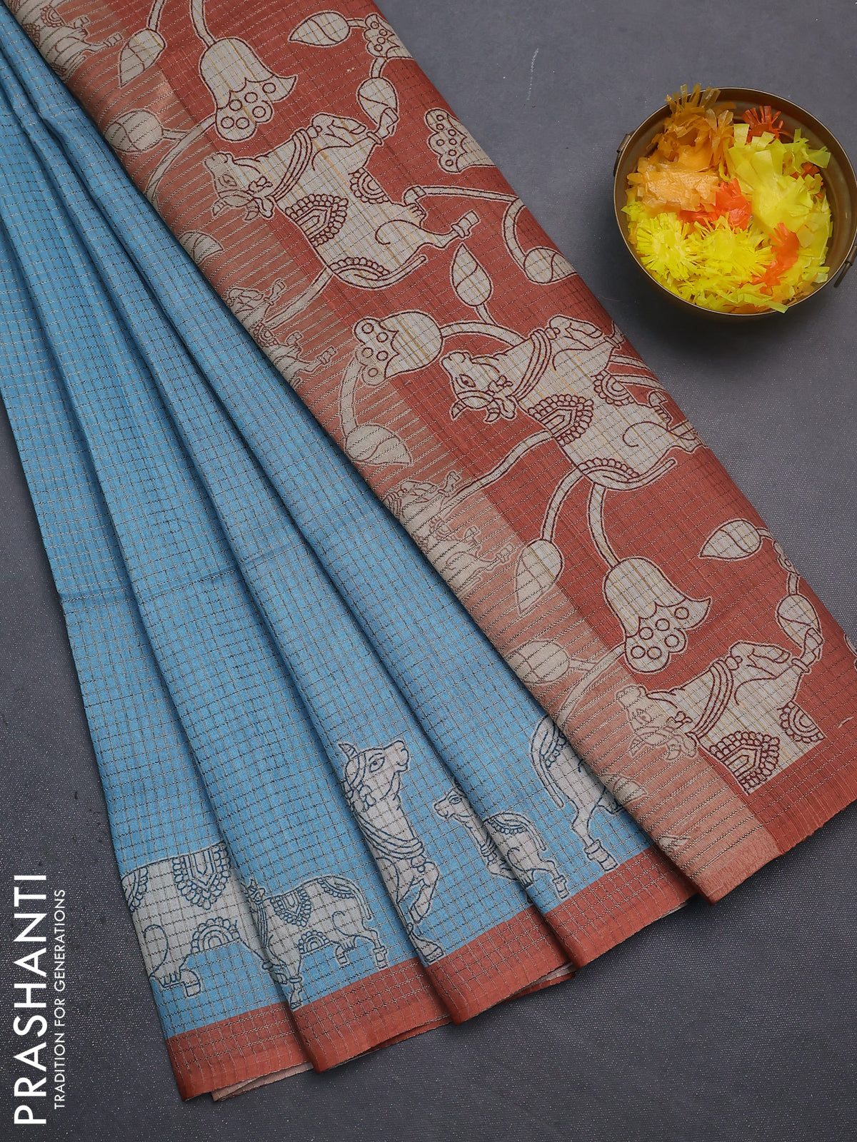 Chappa saree light blue and rust shade with allover small zari checked pattern and pichwai printed pallu