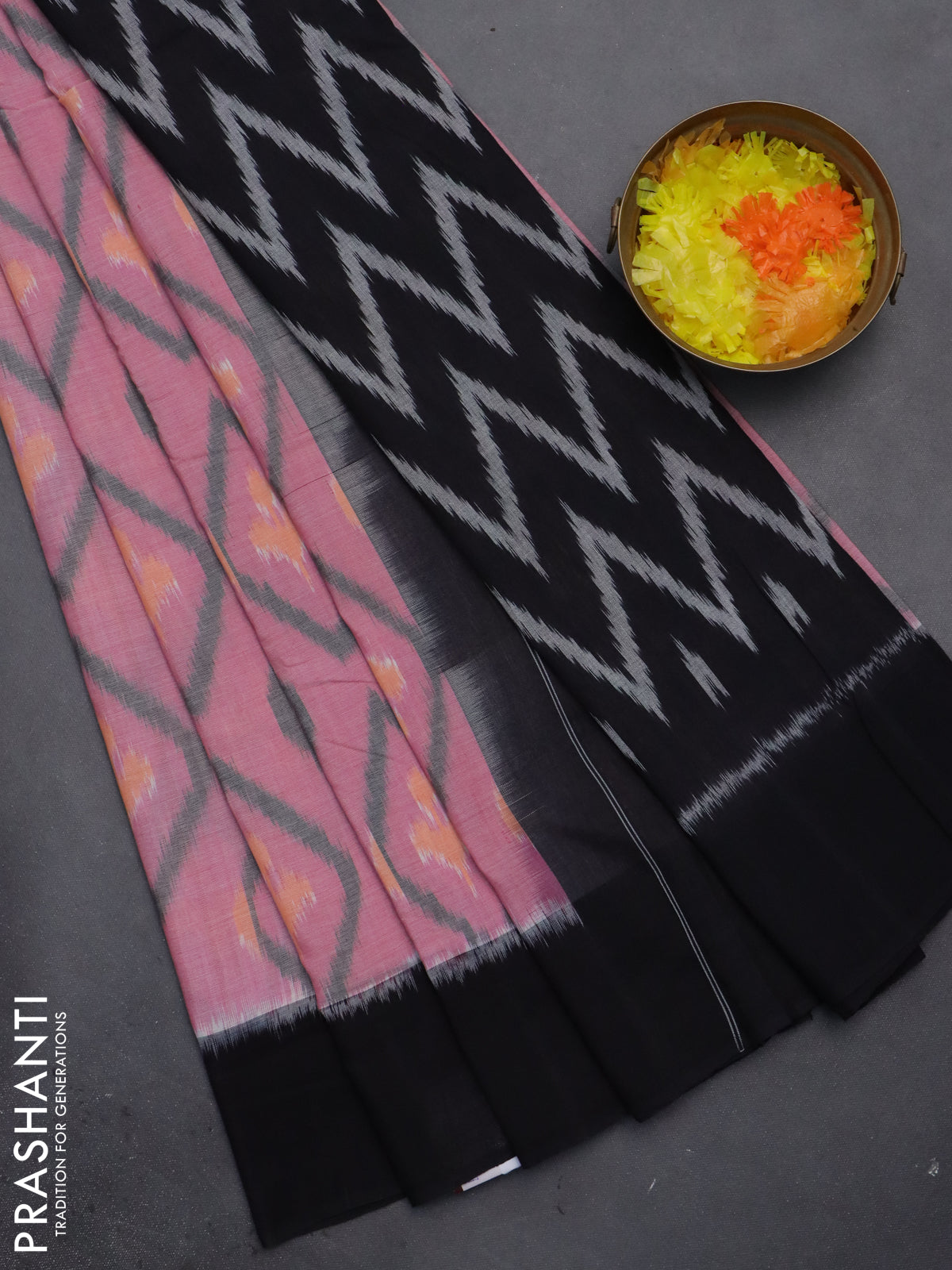 Ikat cotton saree pink shade and black with allover ikat butta weaves and simple border