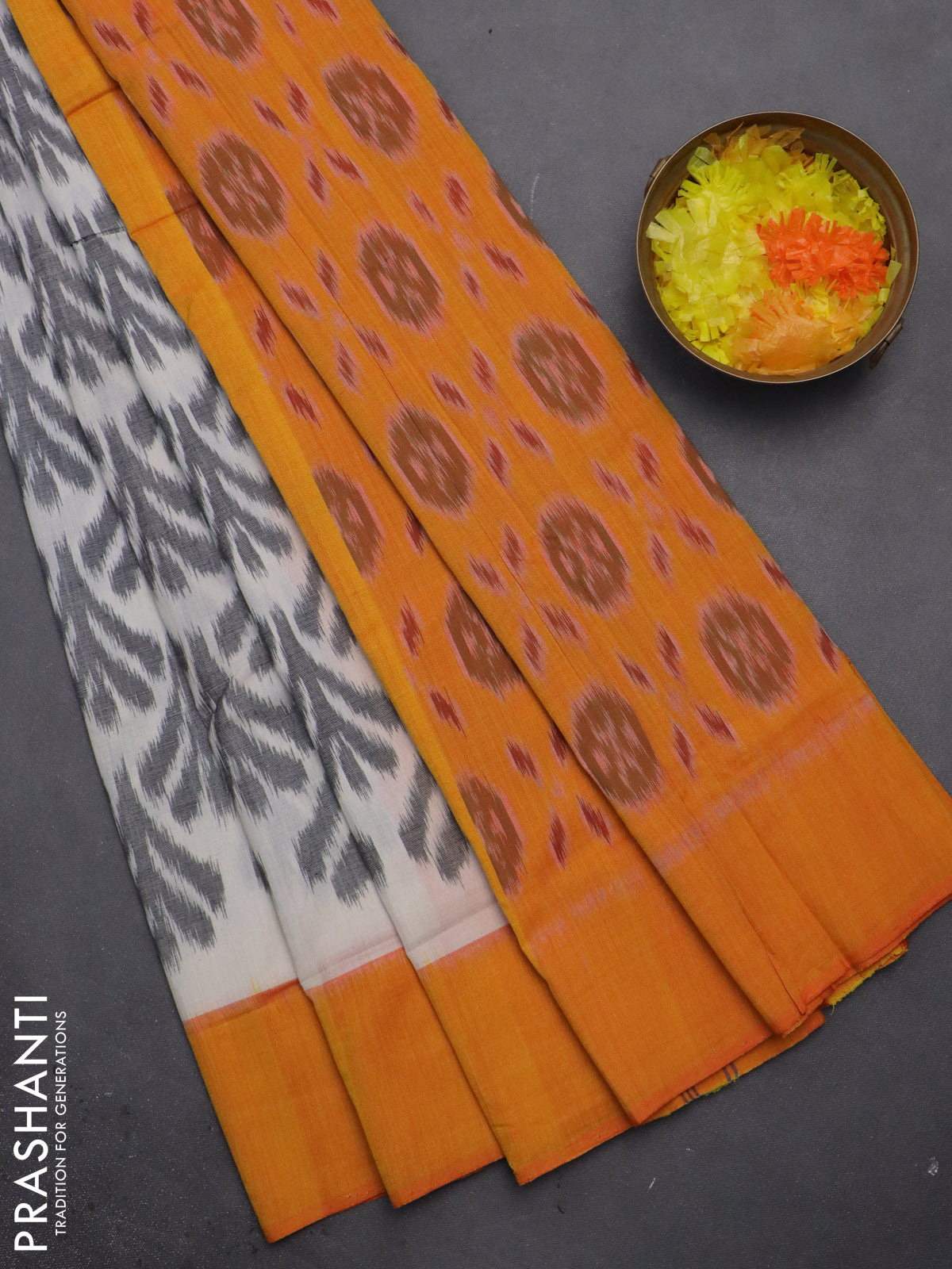 Ikat cotton saree off white and mango yellow with allover ikat weaves and simple border