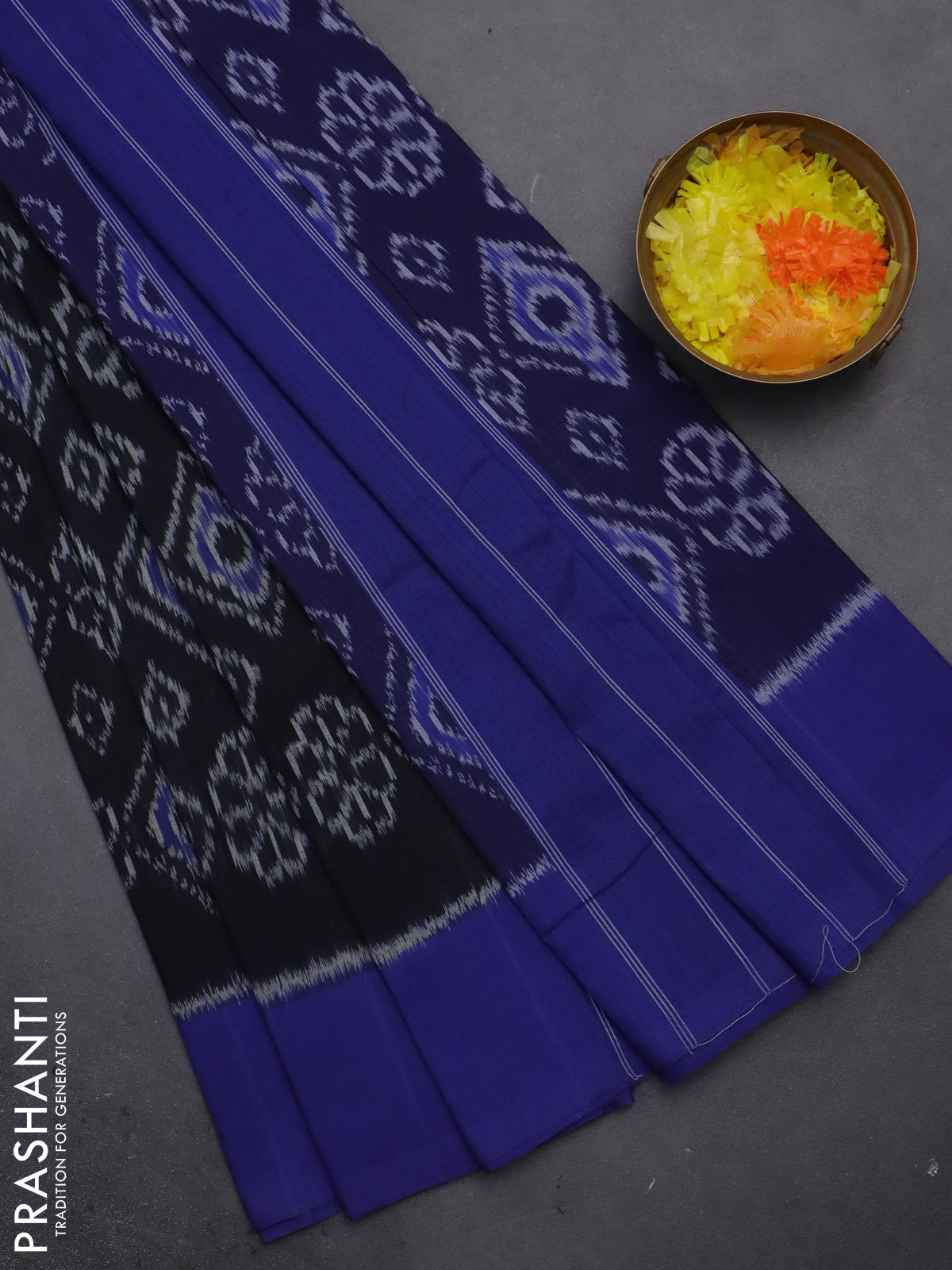 Ikat cotton saree black and blue with allover ikat weaves and simple border