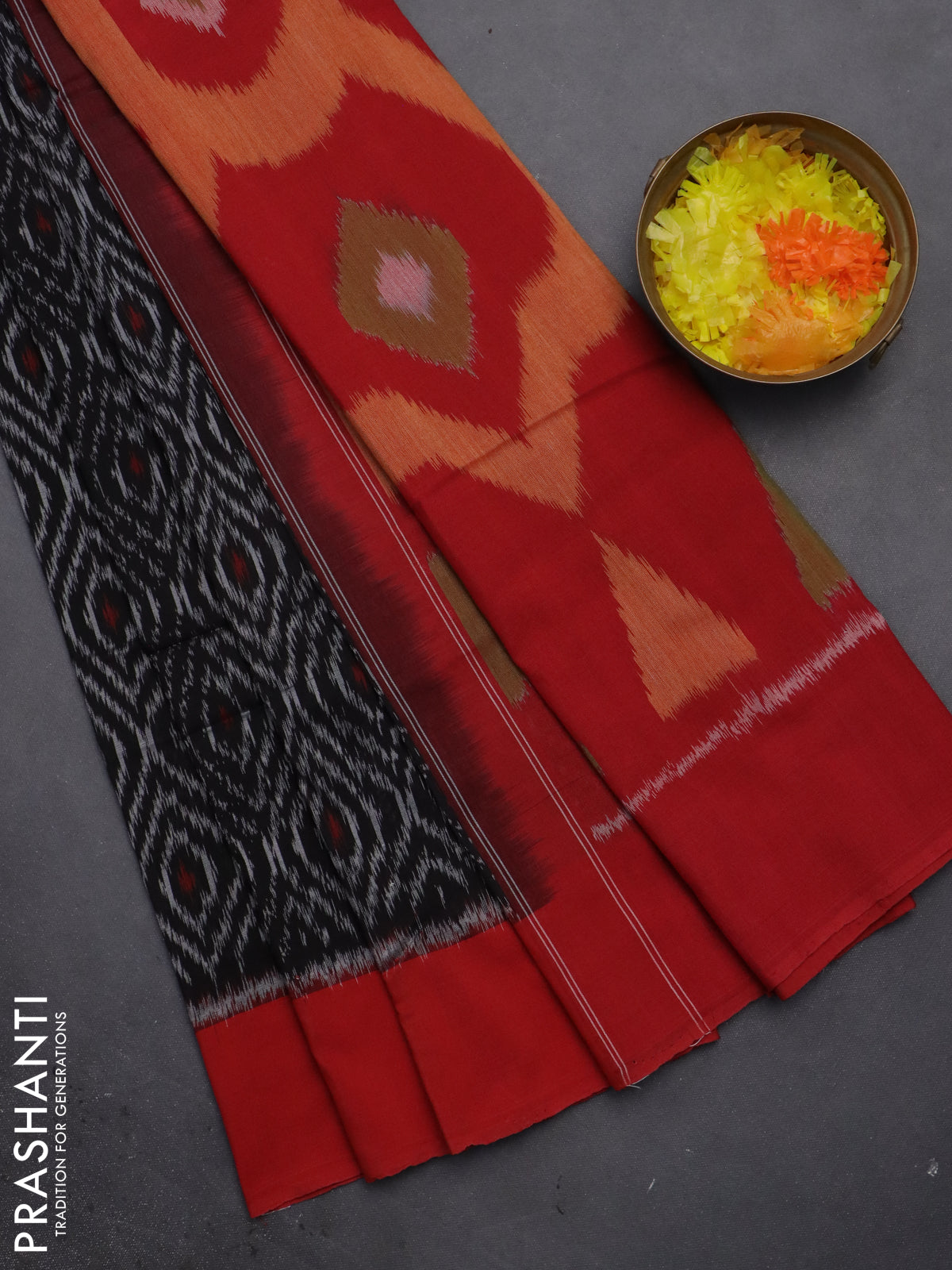 Ikat cotton saree black and red with allover ikat weaves and simple border