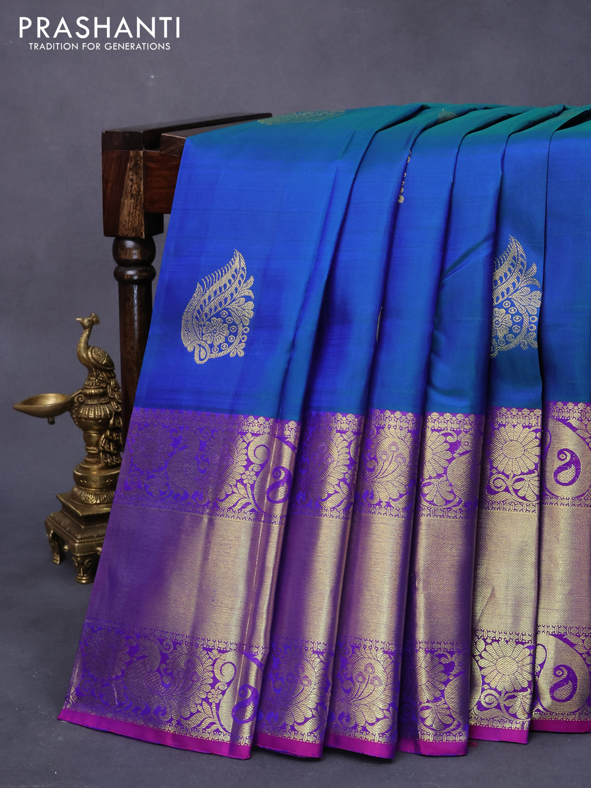 Pure kanjivaram silk saree dual shade of bluish green and dual shade of purple with zari woven buttas and long rich zari woven border