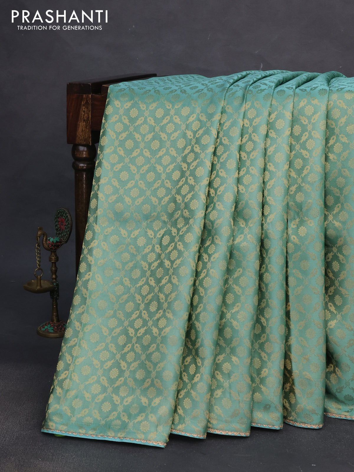 Banarasi semi crepe saree teal blue shade with allover zari woven brocade weaves and lace work border
