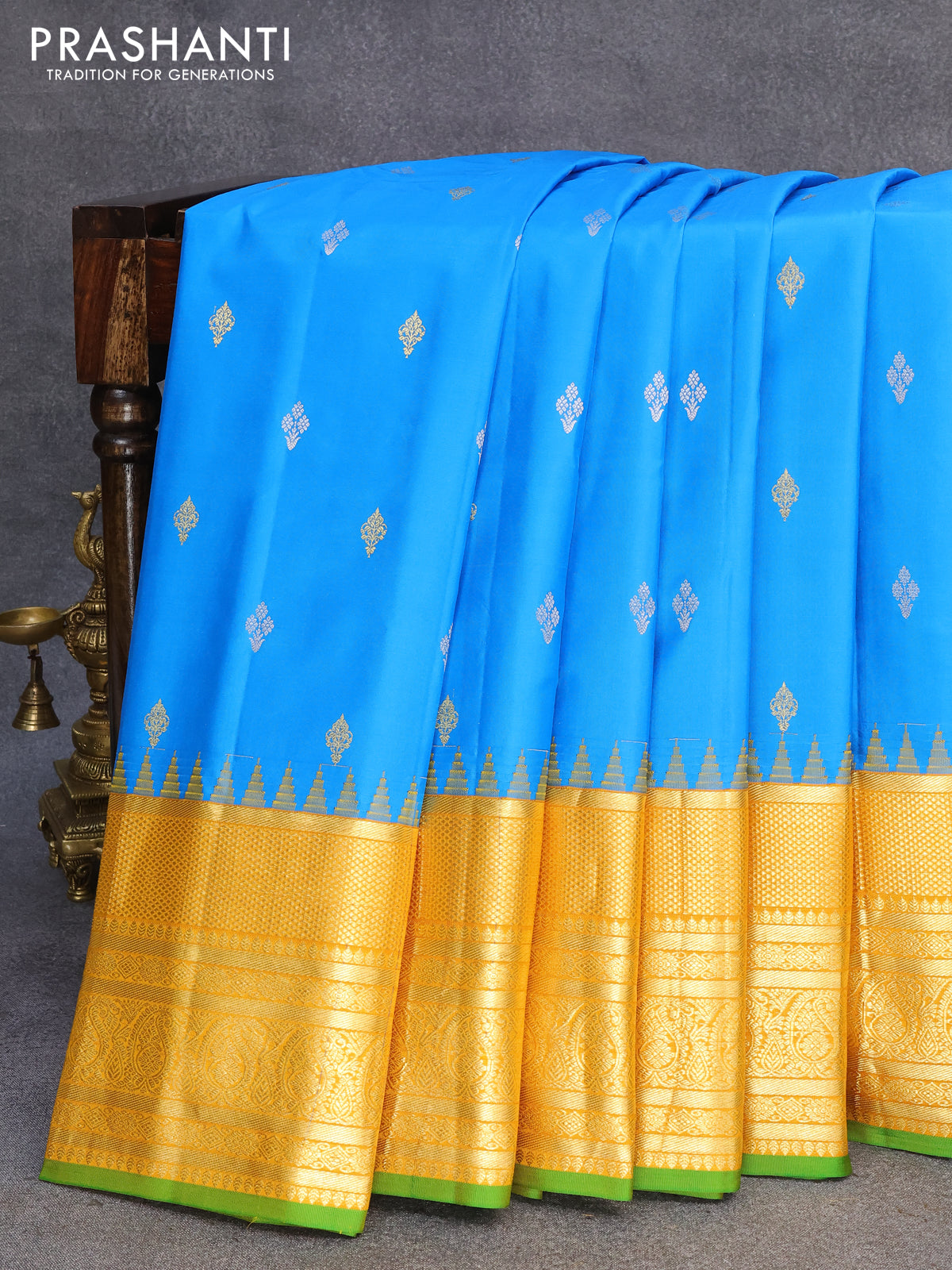 Pure gadwal silk saree cs blue and yellow with zari woven buttas and long zari woven border