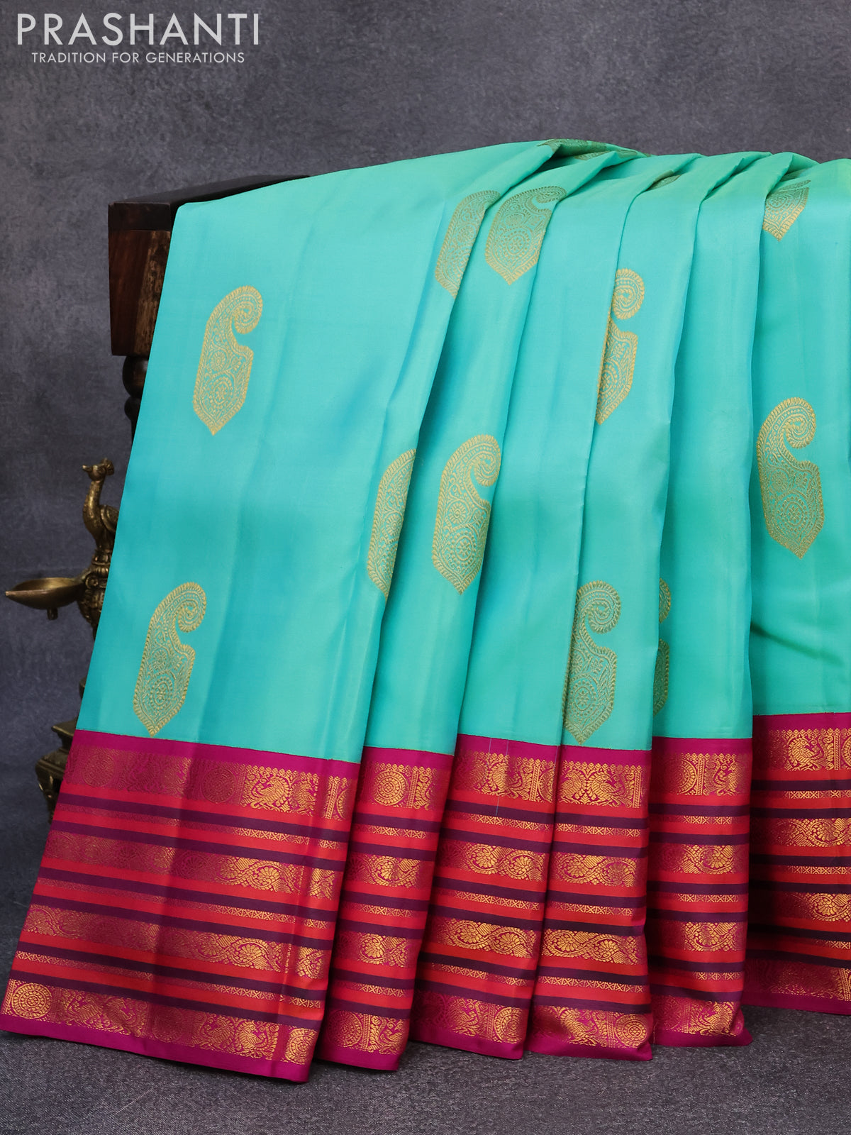 Pure kanjivaram silk saree teal blue shade and purple with paisley zari woven buttas and rich annam & rudhraksha zari woven korvai border butta style