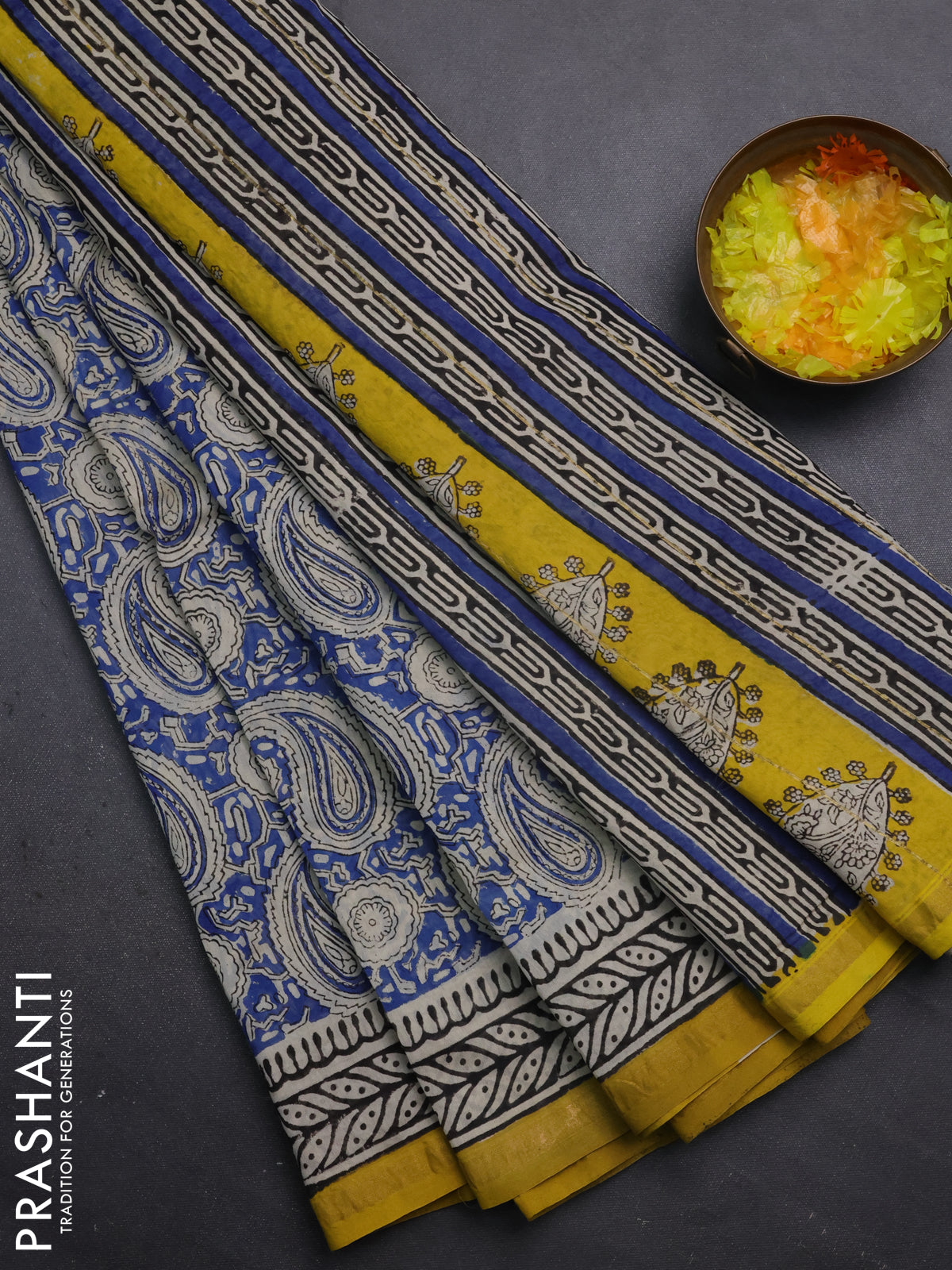 Chanderi bagru saree blue and yellow with allover paisley prints and small zari woven border