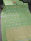 Banarasi mushru silk saree pastel green with allover stripes pattern & zari buttas and satin border