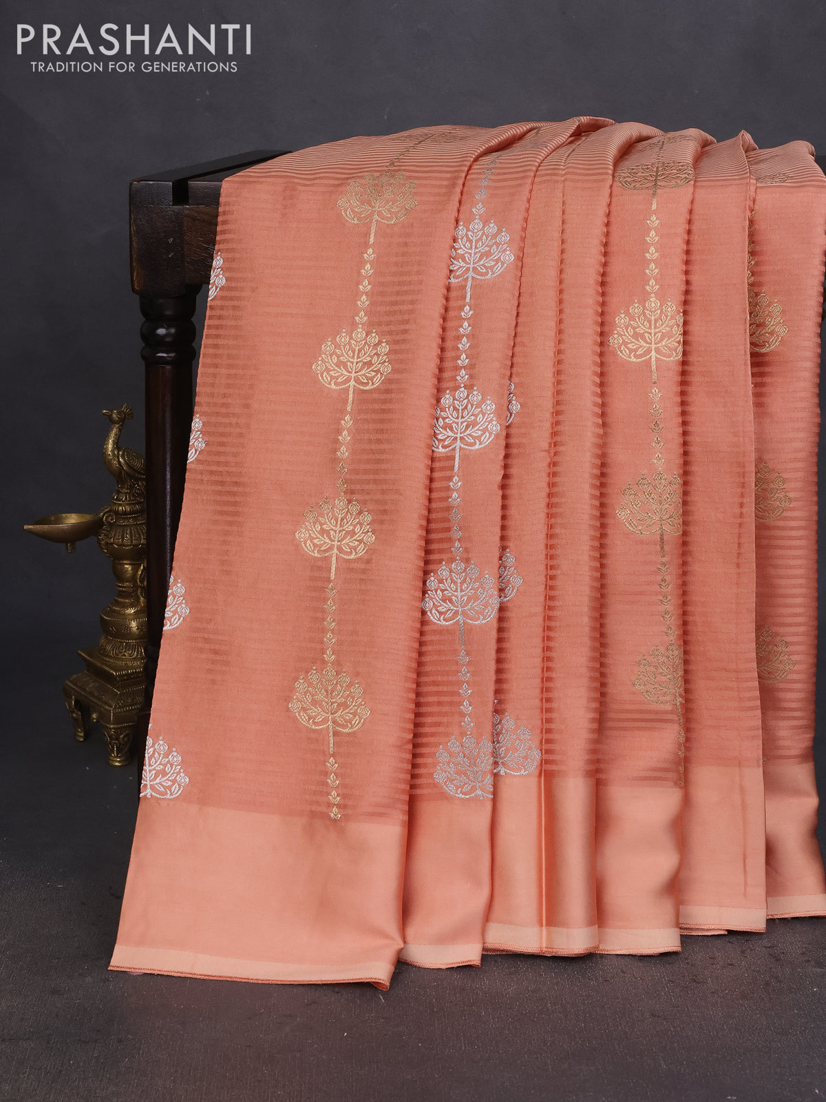 Banarasi mushru silk saree pale orange with allover stripes pattern & zari buttas and satin border
