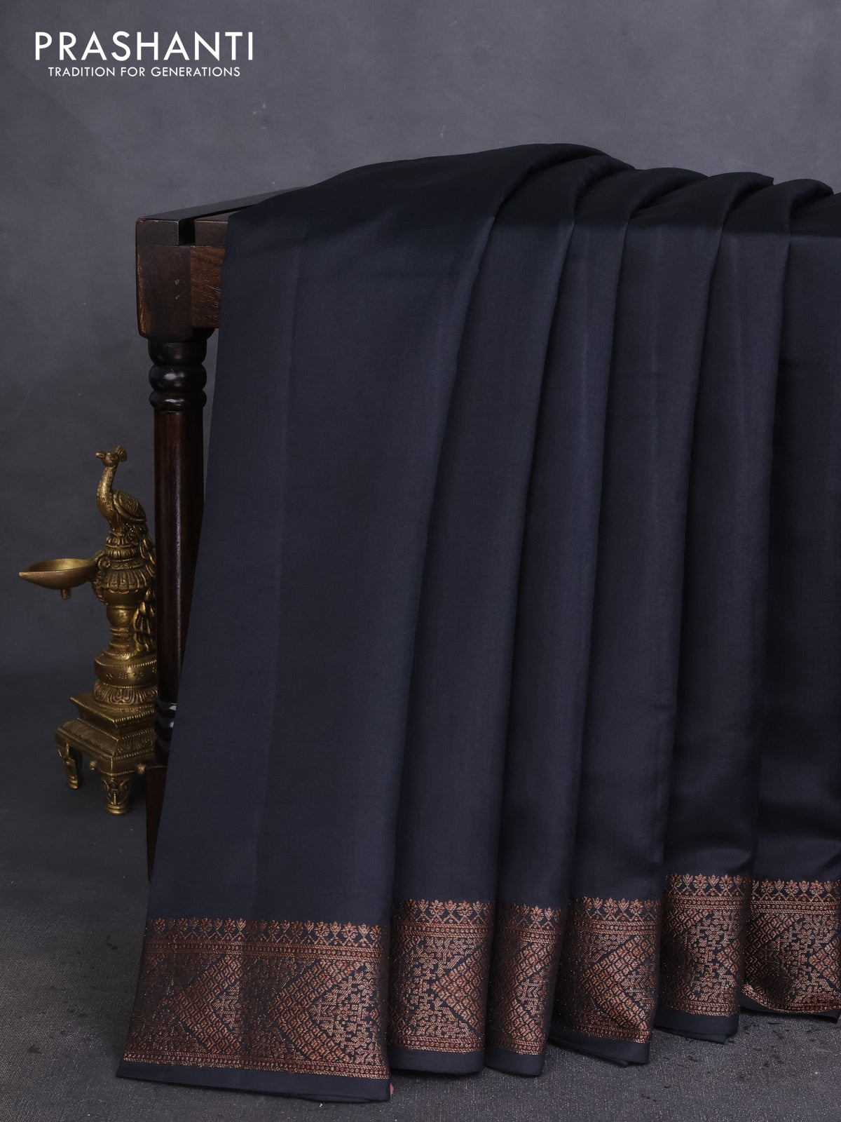 Chiniya silk saree black and maroon with plain body and woven border