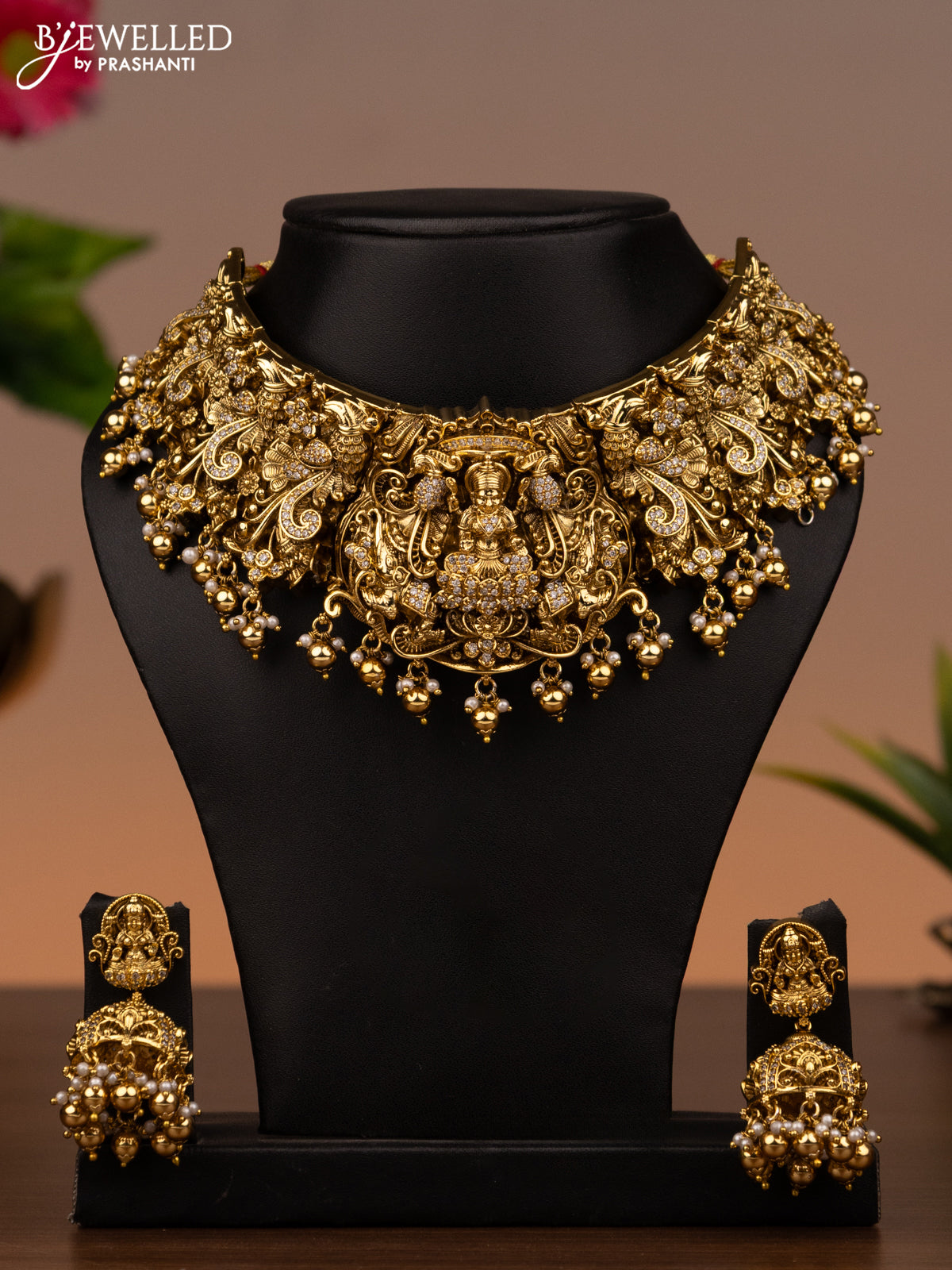 Antique necklace lakshmi design with cz stones and golden beads hanging