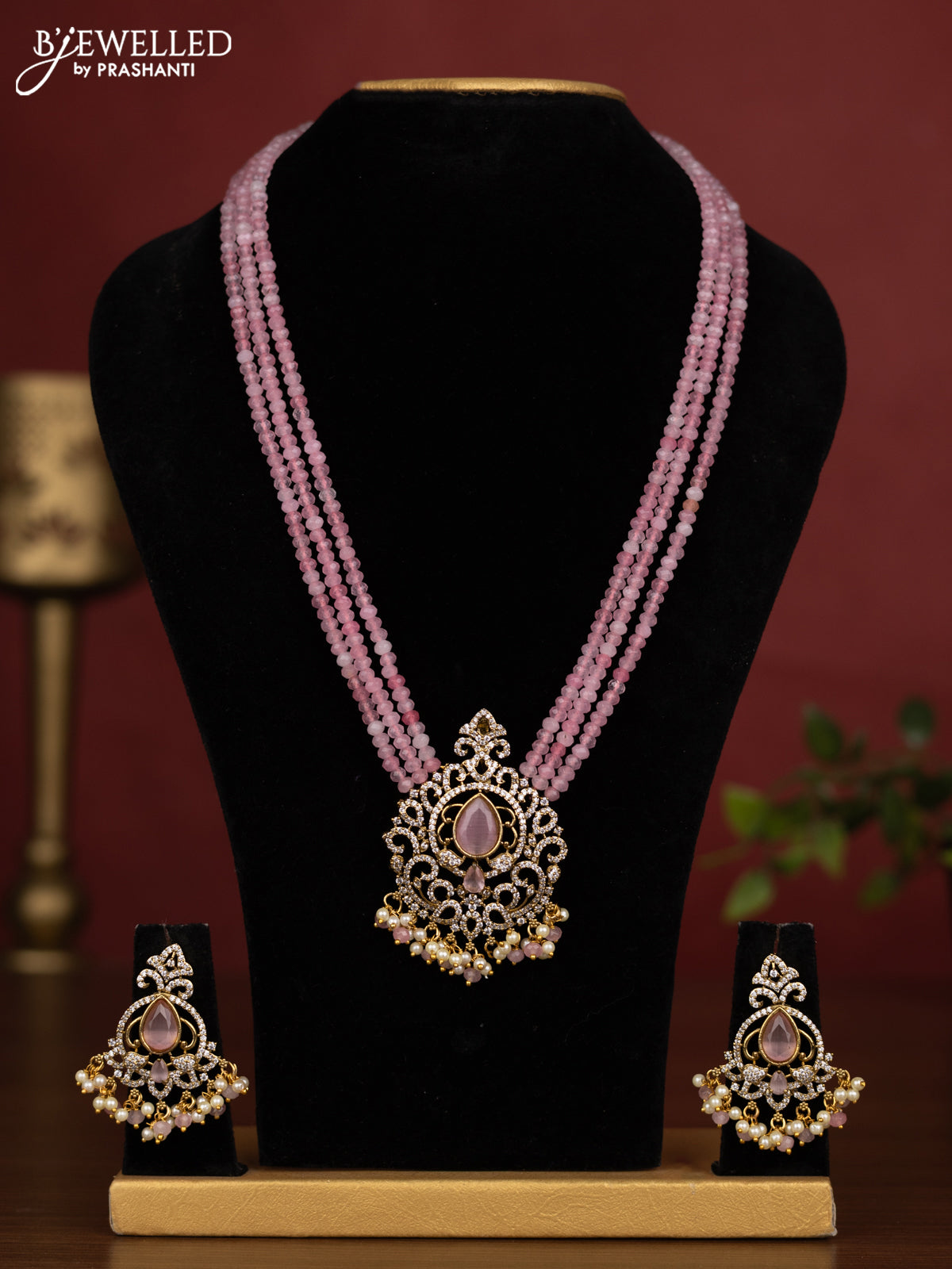 Beaded triple layer baby pink necklace with cz stones and pearl & beads hanging in victorian finish