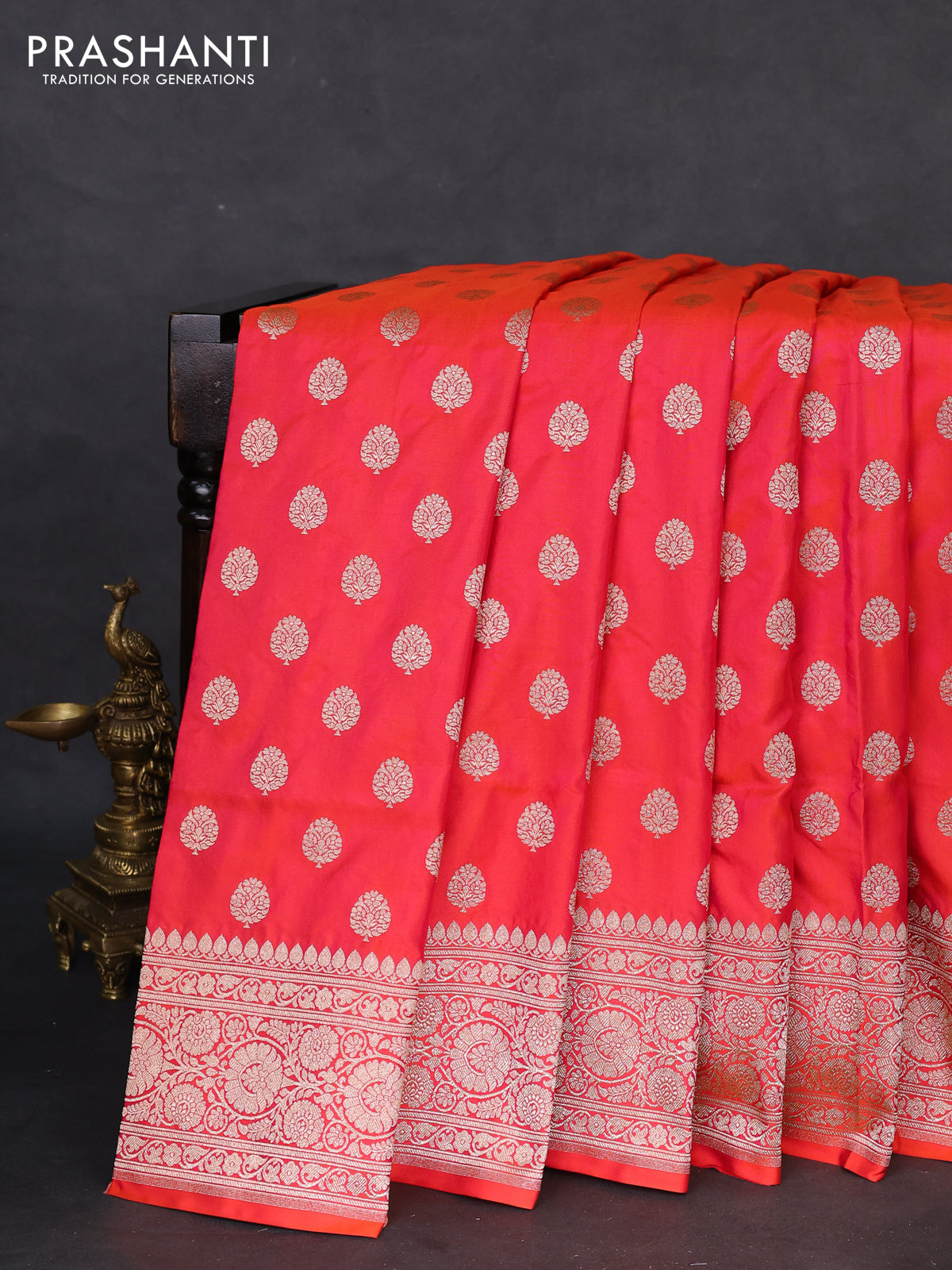 Banarasi uppada silk saree dual shade of pinkish orange with allover zari woven butta weaves and zari woven border