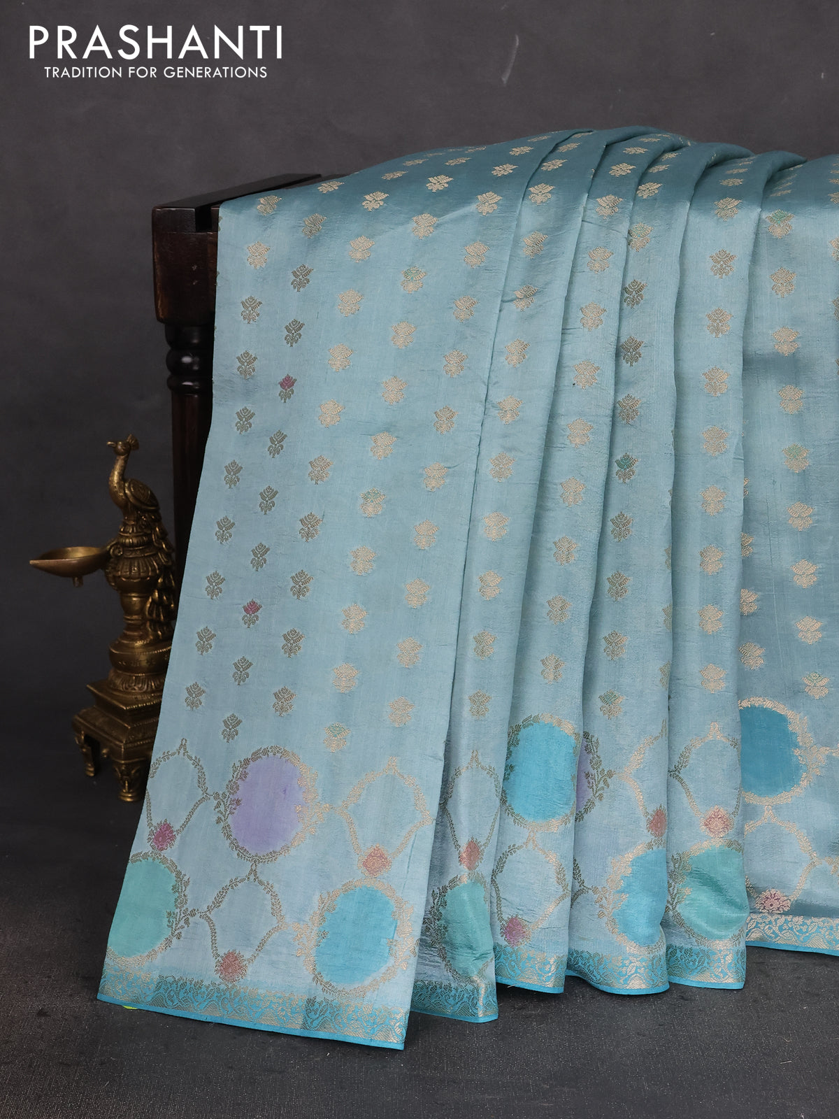 Chiniya silk saree pastel blue with allover zari woven buttas and zari woven border