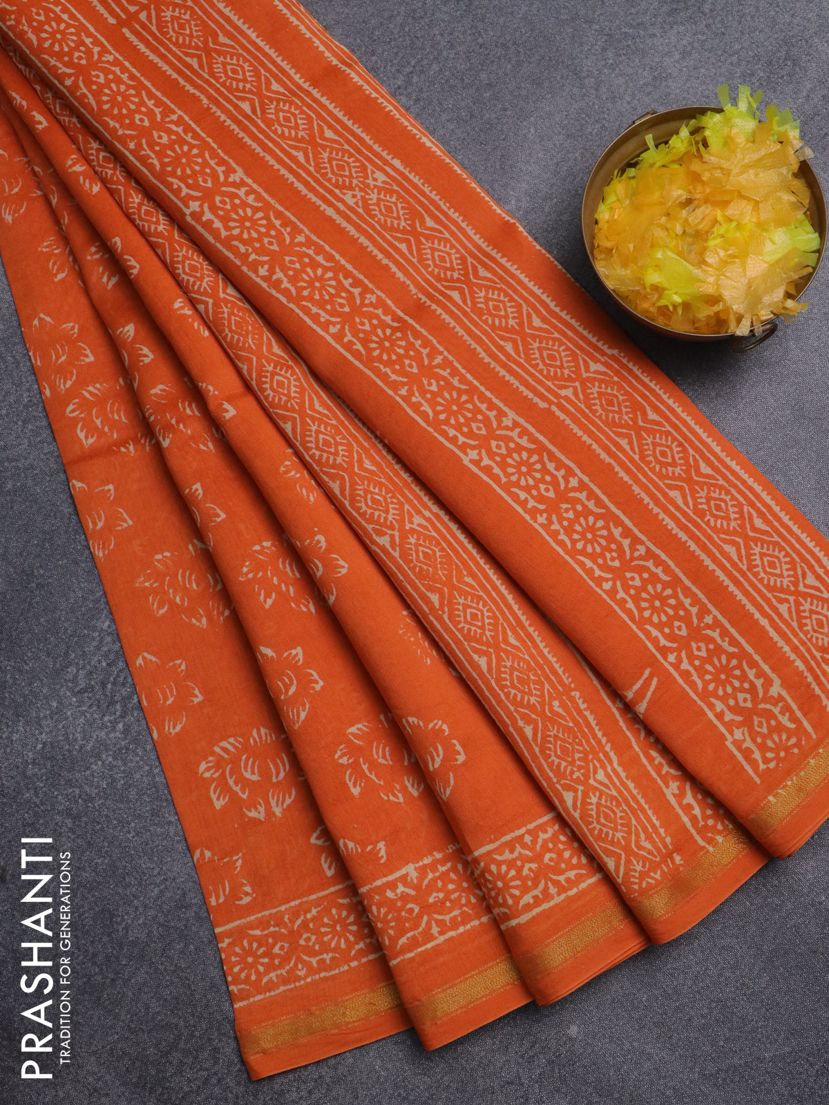 Chanderi bagru saree orange with allover dfloral butta prints and small zari woven border