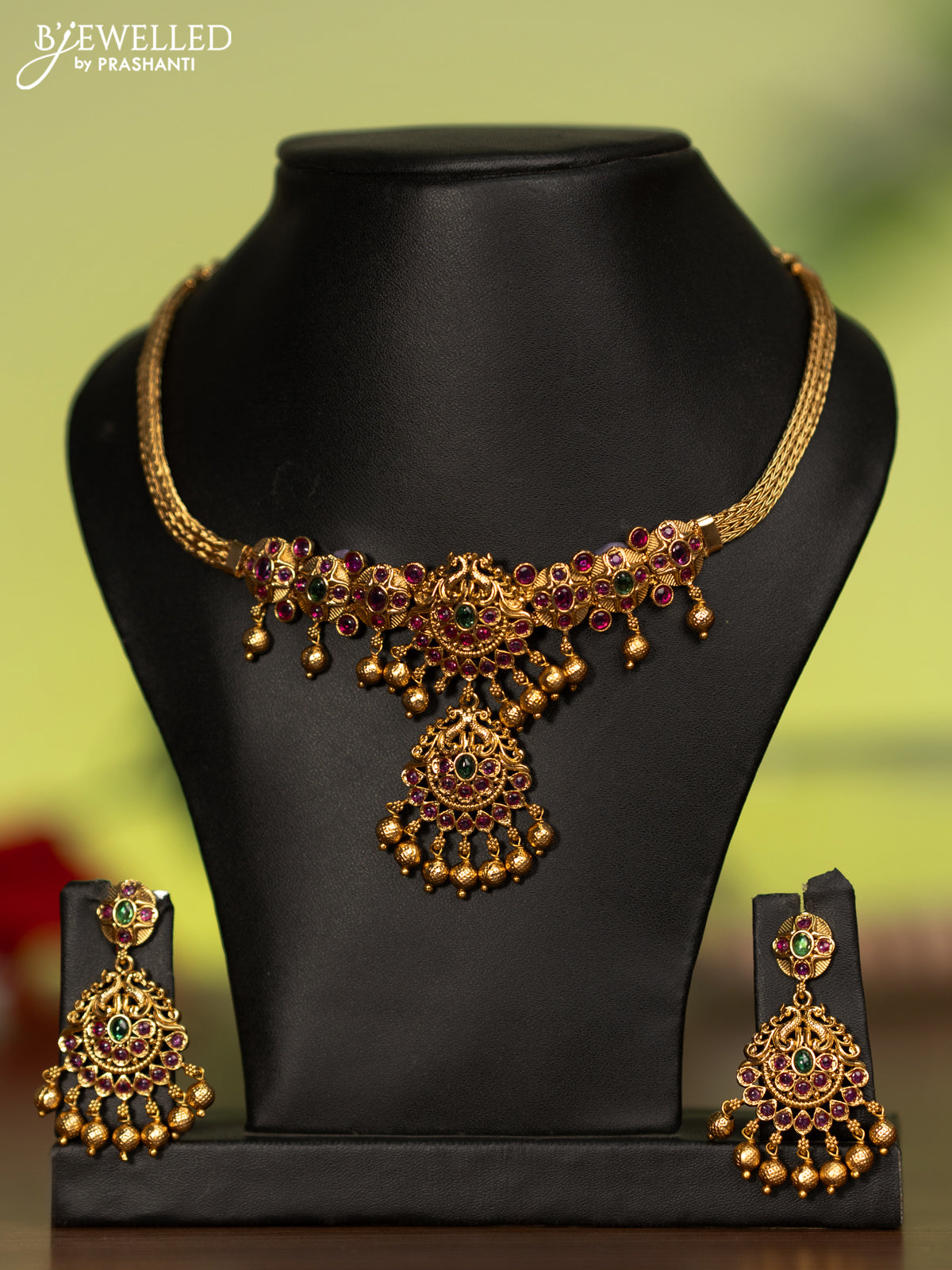 Antique attigai necklace with kemp stones and golden beads hanging