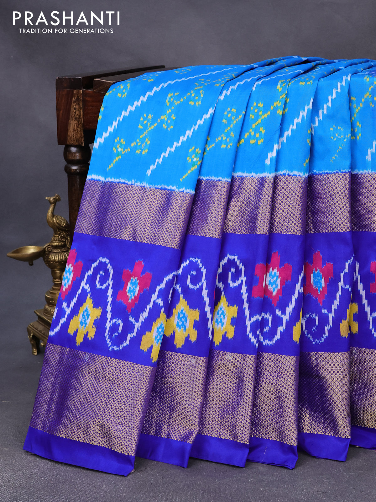 Pochampally silk saree cs blue and blue with allover ikat weaves and long zari woven ikat border