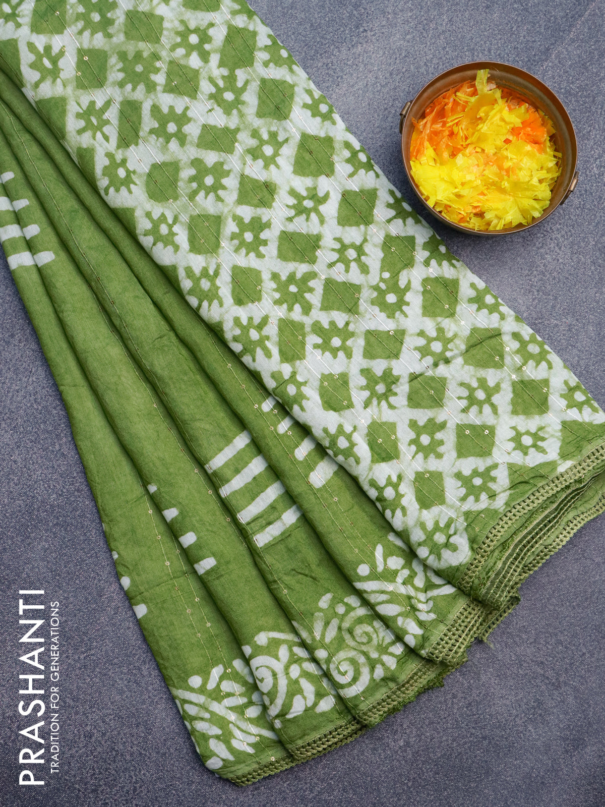 Batik cotton saree light green with allover sequin work & batik butta prints and printed lace work border