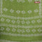 Batik cotton saree light green with allover sequin work & batik butta prints and printed lace work border