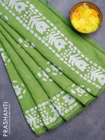 Batik cotton saree light green with allover sequin work & batik butta prints and printed lace work border