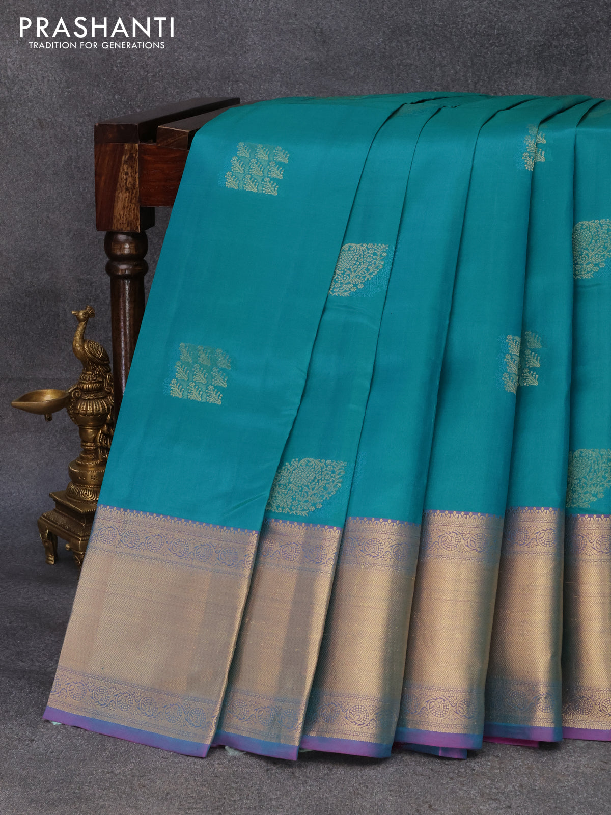 Pure kanjivaram silk saree teal green shade and dual shade of purple with thread & zari woven buttas and long zari woven border