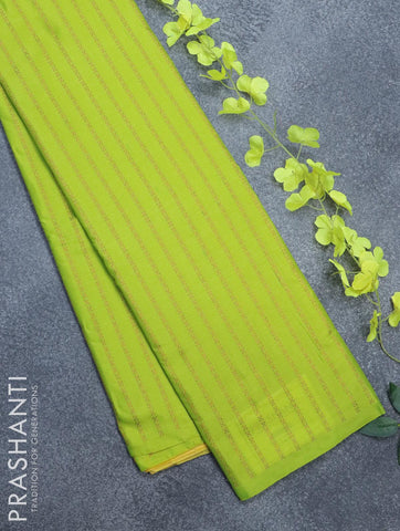 Arani semi silk saree fluorescent green and yellow with allover copper zari weaves in borderless style