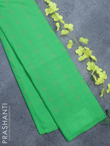 Arani semi silk saree green with allover copper zari weaves in borderless style