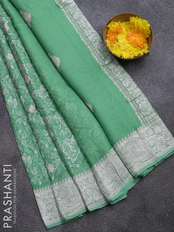 Banarasi chiffon saree green shade   with allover chikankari work and silver zari woven border