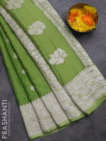 Banarasi chiffon saree light green   with allover chikankari work and silver zari woven border