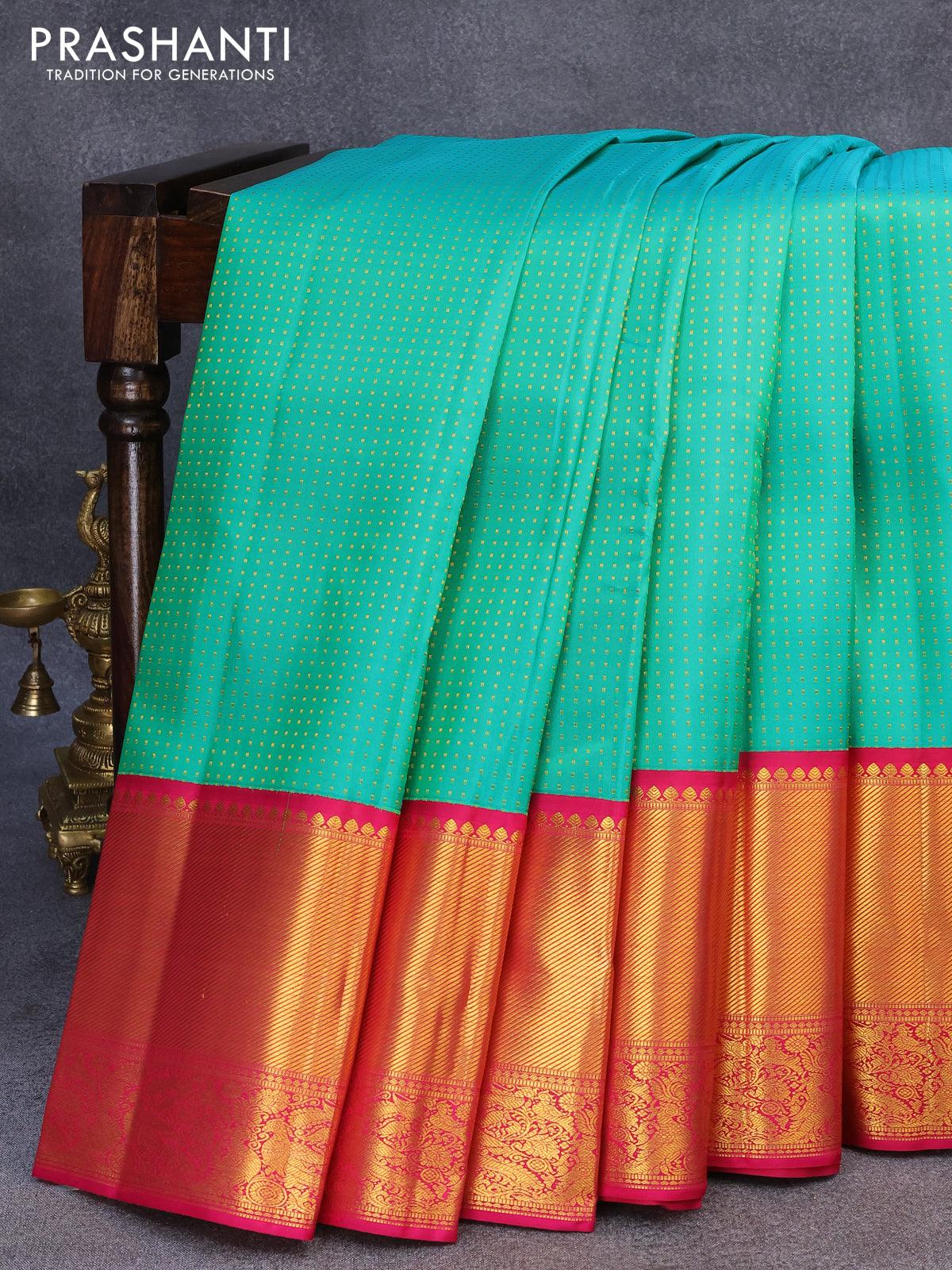 Pure kanjivaram silk saree teal green and pink with allover zari woven butta weaves and long zari woven border