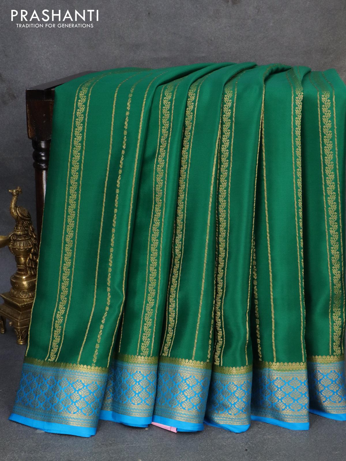 Pure mysore silk saree green and cs blue with allover weaves and zari woven border