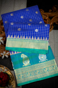 Varamahalakshmi Royal Blue & Sea Green Venkatagiri Checks And Buttis Saree